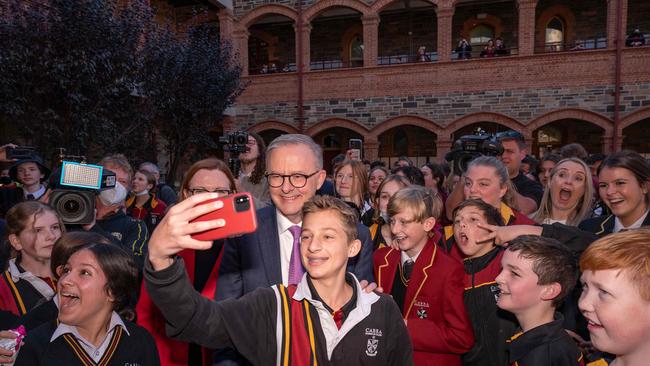 Opposition Leader Anthony Albanese poses for pictures with students from Cabra Dominican College on Friday. (Photo by Wendell Teodoro / AFP)