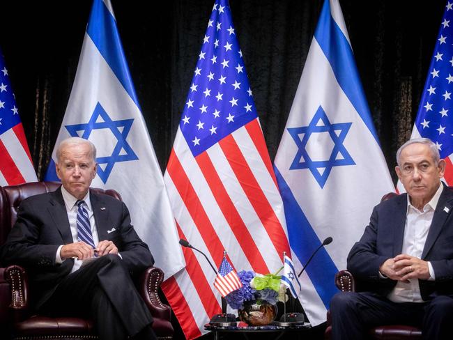 US President Joe Biden (L), sits with Israeli Prime Minister Benjamin Netanyahu, at the start of the Israeli war cabinet meeting, in Tel Aviv on October 18, 2023, amid the ongoing battles between Israel and the Palestinian group Hamas. US President Joe Biden landed in Tel Aviv on October 18, 2023 as Middle East anger flared after hundreds were killed when a rocket struck a hospital in war-torn Gaza, with Israel and the Palestinians quick to trade blame. (Photo by Miriam Alster / POOL / AFP)