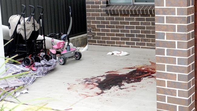 The bloodied crime scene at the doorstep of a neighbouring property where Mejid Hamzy stumbled after being shot and killed last month. Picture: Jeremy Piper