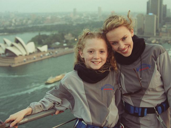 Kylie Minogue with the young Olympic Games sensation Nikki Webster on top of Sydney Harbour Bridge in September 2000.