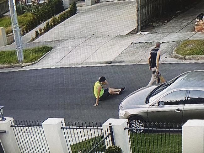 CCTV captured a fight between two men, with one wielding a cricket bat, outside the front of a rooming house on Albion St, Caulfield South.