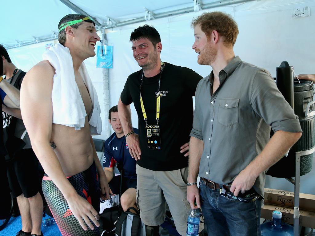 Prince Harry chats with GB Armed Forces Team Captain David Wiseman and Dave Henson in the competitor's tent during the Invictus Games in Orlando. Picture: Getty Images for Invictus