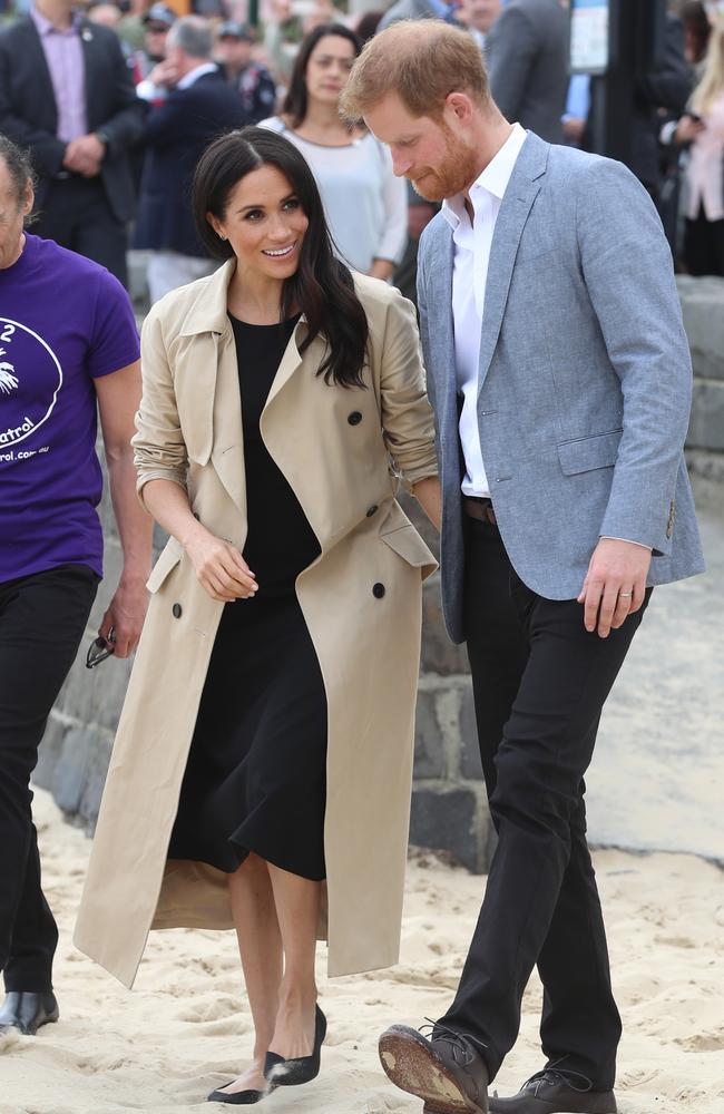 Not standard beach attire! The Duchess of Sussex changed outfits from Dion Lee to this Club Monaco frock. Prince Harry removed his tie and changed into a relaxed blazer. Picture: Alex Coppel