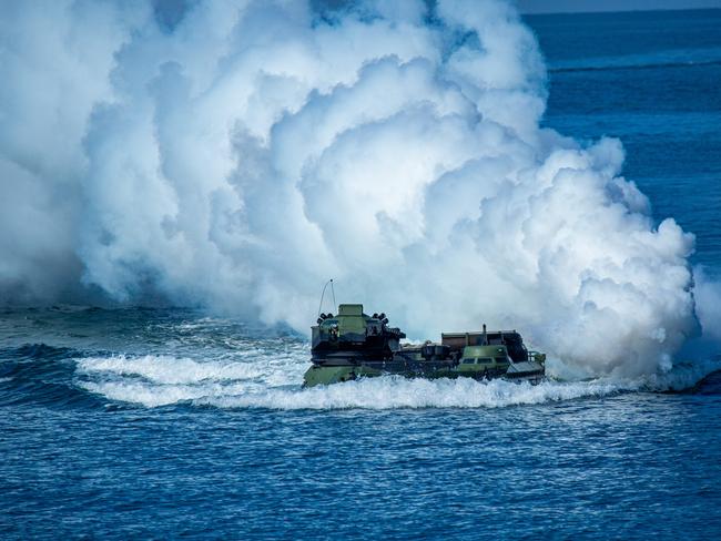 PINGTUNG, TAIWAN - JULY 28: Taiwan's AAV7 amphibious assault vehicle maneuvers across the sea during the Han Kuang military exercise, which simulates China's People's Liberation Army (PLA) invading the island, on July 28, 2022 in Pingtung, Taiwan. Taiwan military launches five days of live fire drills involving all forces of the military to repel simulated attacks from China. (Photo by Annabelle Chih/Getty Images)