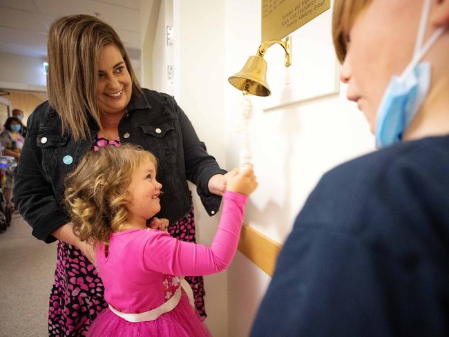 Ivy ringing the bell on the Kookaburra oncology ward, to signal the end of her cancer treatment. Picture: Mark Stewart