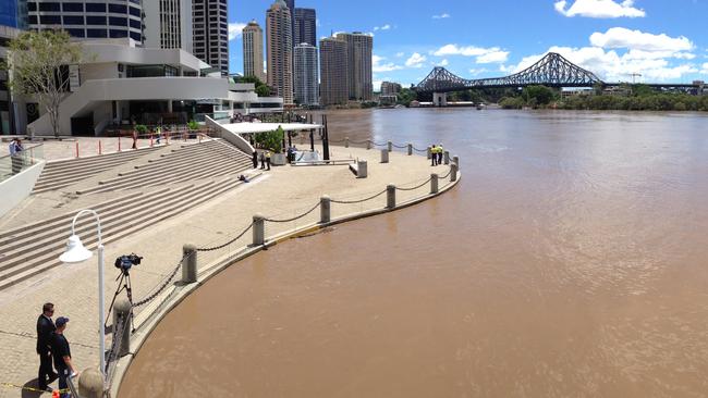 January 2013: Brisbane River peaking around Eagle Street Pier. Picture: Pete Wallis