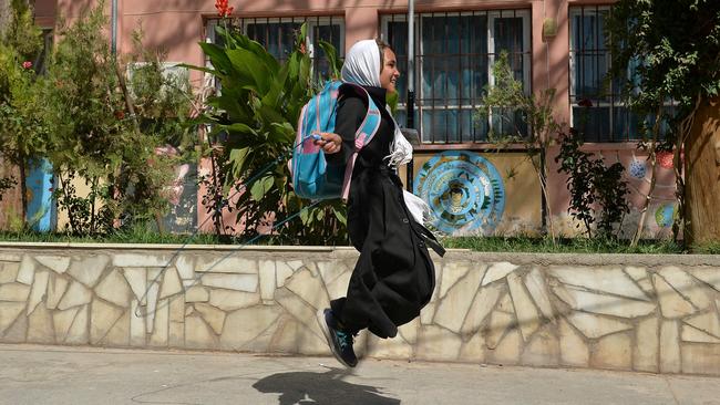 A girl skips in the playground at the Gawhar Shad Begum school in Herat. Picture: AFP