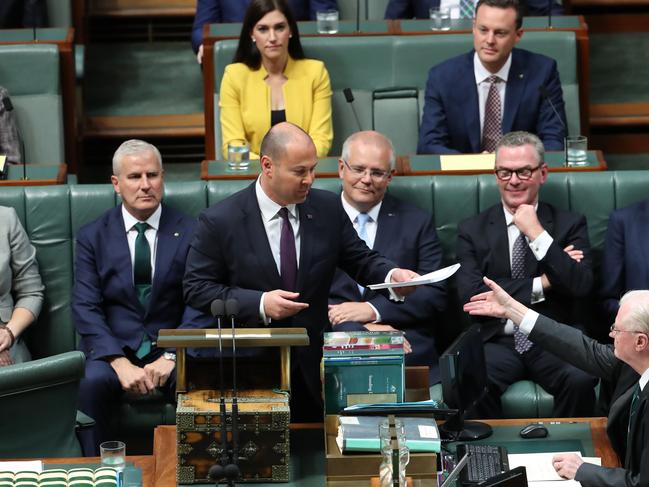 Treasurer Josh Frydenberg delivers the Budget speech watched on by Prime Minister Scott Morrison. Picture: Gary Ramage