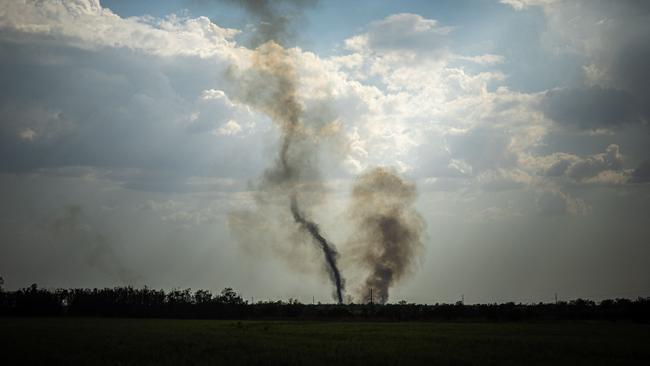 Black smoke rises at the front line in Mykolaiv Oblast this week. Picture: AFP