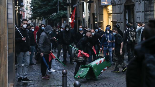 Demonstrators protest against the curfew and other coronavirus measure introduced in Naples, southern Italy, over the weekend. Picture: AFP