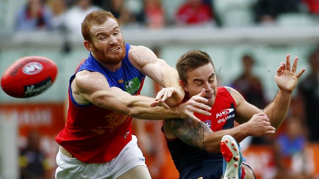Ben Kennedy gets a kick away under pressure from Daniel Merrett. Picture: Colleen Petch