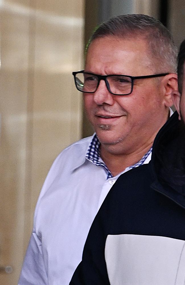 Fadi Mohammed Hijazi (in white shirt) leaves the Supreme Court, Brisbane. pic: Lyndon Mechielsen/Courier Mail