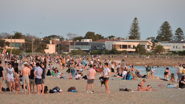 Crowds of people enjoy the warm start to spring at Elwood Beach in Melbourne. Picture: Josie Hayden