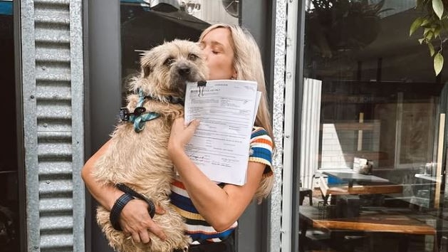 Hannah Wagner and her dog Daisy after signing the lease for Dark Blue on Fortitude Valley's Winn Lane