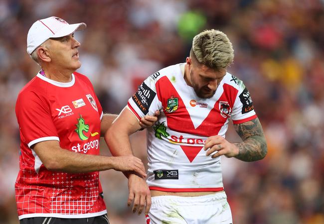 Gareth Widdop leaves the field with a dislocated shoulder. 