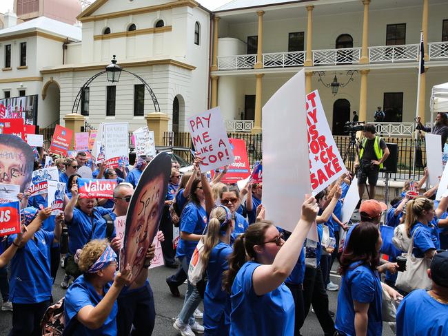 SYDNEY, AUSTRALIA : NewsWire Photos - NOVEMBER 13 2024; Nurses and midwives hold a 24-hour statewide strike, as frontline workers rally today. They march from Hyde Park down Elizabeth street to outside Parliament House in Sydney, with demands for fair wages, while patients across NSW will be left waiting. Picture: NewsWire / Gaye Gerard