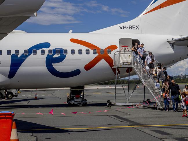 The first Rex Airlines aircraft  landing at Gold Coast Airport. Rex has started  new twice daily  services between the Gold Coast and Melbourne. Passengers exiting the aircraft after arriving on the Gold Coast from Melbourne.  Picture: Jerad Williams