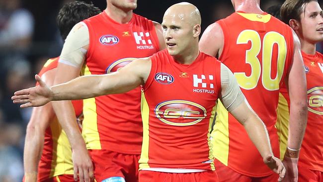 Gary Ablett of the Suns celebrates a goal against the Geelong Cats at Metricon Stadium.