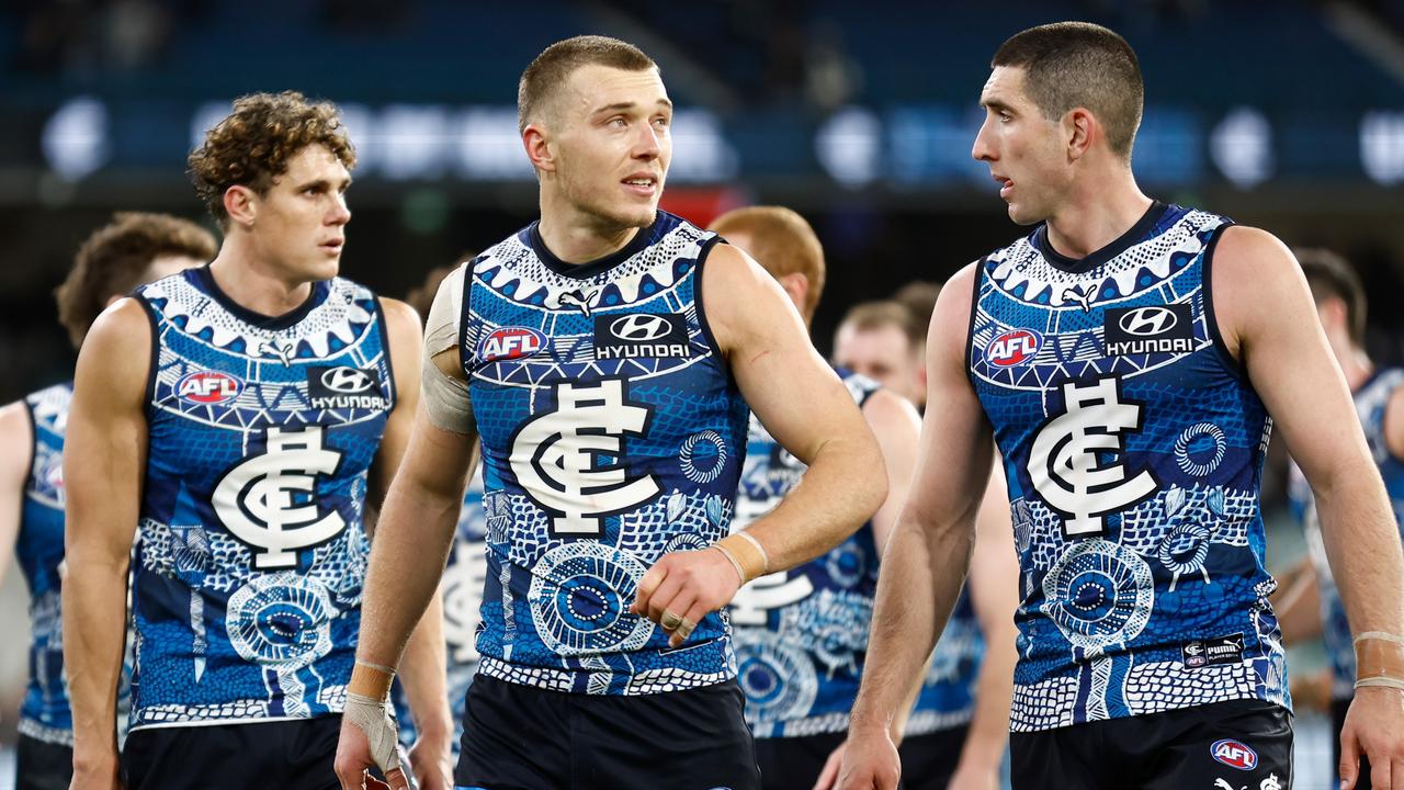 MELBOURNE, AUSTRALIA - MAY 21: Patrick Cripps (left) and Jacob Weitering of the Blues look dejected after a loss during the 2023 AFL Round 10 match between the Carlton Blues and the Collingwood Magpies at the Melbourne Cricket Ground on May 21, 2023 in Melbourne, Australia. (Photo by Michael Willson/AFL Photos via Getty Images)