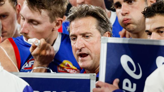 MELBOURNE, AUSTRALIA - JUNE 07: Luke Beveridge, Senior Coach of the Bulldogs addresses his players at three quarter time during the 2024 AFL Round 13 match between the Western Bulldogs and the Brisbane Lions at Marvel Stadium on June 07, 2024 in Melbourne, Australia. (Photo by Dylan Burns/AFL Photos via Getty Images)