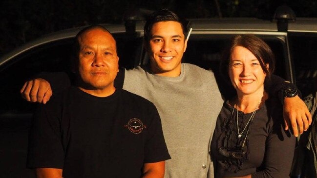 Josh Tam (centre) with his father John and mother Julie. Picture: Facebook