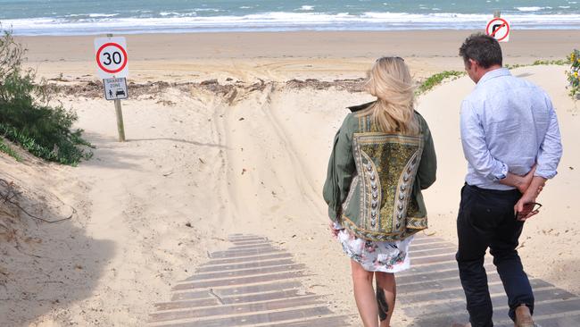 Clair Fitzpatrick and Cr Adam Belot walk down the steep incline at the Bangalee access to Farnborough Beach that has users concerned for everyone's safety.