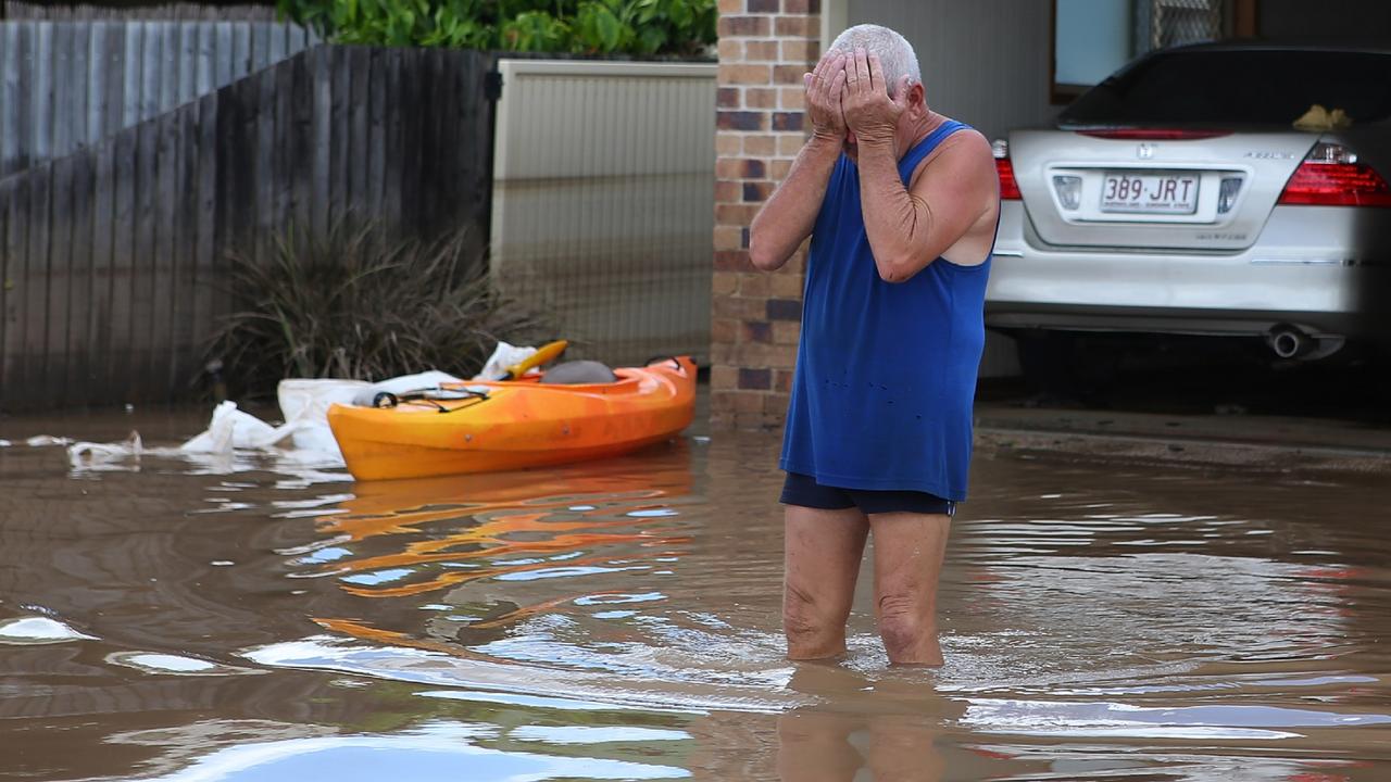 A resident reacts to the damage to his house as parts of southern Queensland experiences record flooding in the wake of Tropical Cyclone Oswald on January 30, 2013 in Bundaberg, Australia. Flood waters peaked at 9.53 metres in Bundaberg yesterday and began receding overnight, as residents and relief teams prepare to clean-up debris. Four deaths were confirmed in the Queensland floods. (Photo by Chris Hyde/Getty Images) Pic. Getty Images