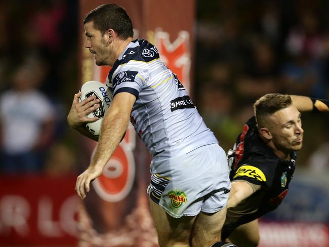 Lachlan Coote evades a tackle by Bryce Cartwright. Picture Gregg Porteous