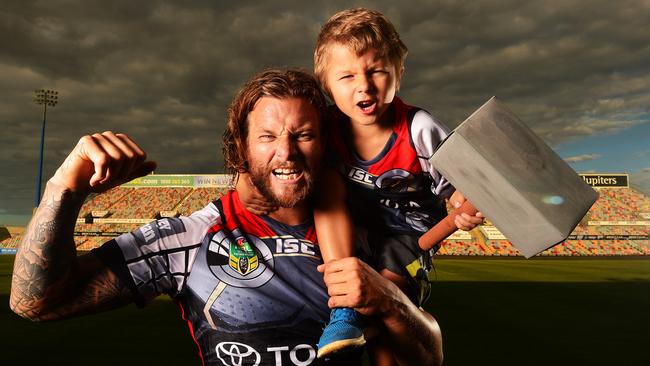 Ashton Sims with son Kobi dressed in their Cowboys Thor jerseys in 2014. Picture: Zak Simmonds