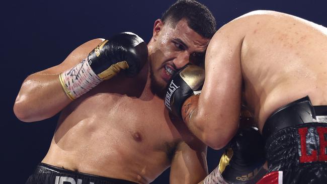 Justis Huni punches Kiki Toa Leutele during their brutal fight at Nissan Arena in Brisbane. Picture: Chris Hyde/Getty Images