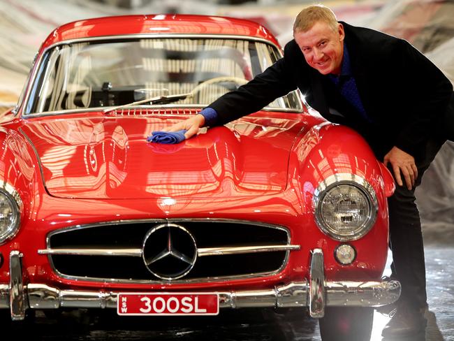 Tony Denny with a 300SL Gulling 1955 at the opening of his $70 million Gosford Classic Car Museum earlier this year. Picture: Sue Graham