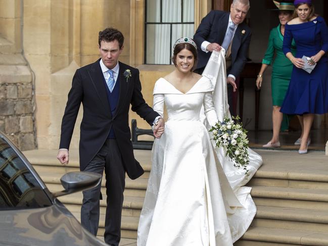 The party begins! Jack Brooksbank and Princess Eugenie, with assistance from Prince Andrew, Princess Beatrice and Fergie. Picture: Getty Images