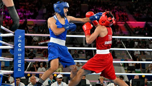 Thailand's Janjaem Suwannapheng and Algeria's Imane Khelif (blue) compete in the women's 66kg semi-final boxing match. Picture: AFP