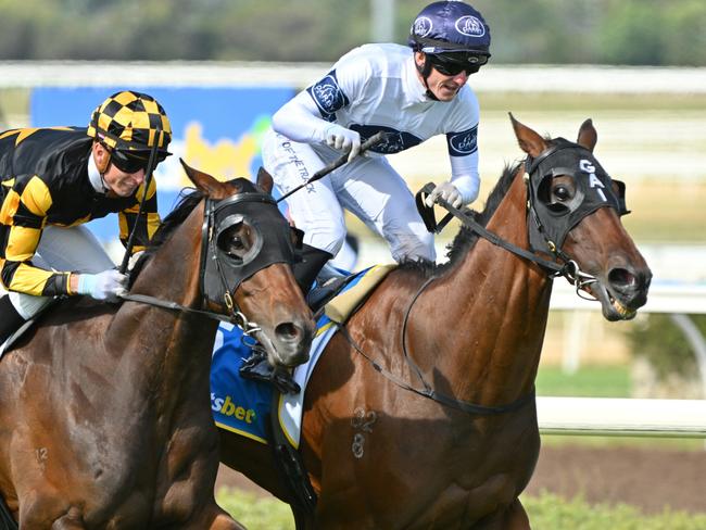 PAKENHAM, AUSTRALIA - DECEMBER 21: Beau Mertens riding Goldman defeats Zac Spain riding Grand Pierro in Race 9, the Sportsbet Pakenham Cup during Melbourne Racing at Pakenham Racing Club on December 21, 2024 in Pakenham, Australia. (Photo by Vince Caligiuri/Getty Images)