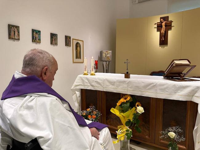 Pope Francis during a mass in the chapel of the apartment of the Gemelli Hospital where he is hospitalised with pneumonia. Picture: Vatican Media/AFP