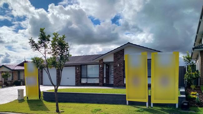 A photo of real estate signs captured in the Blacktown area. Note: picture blurred.