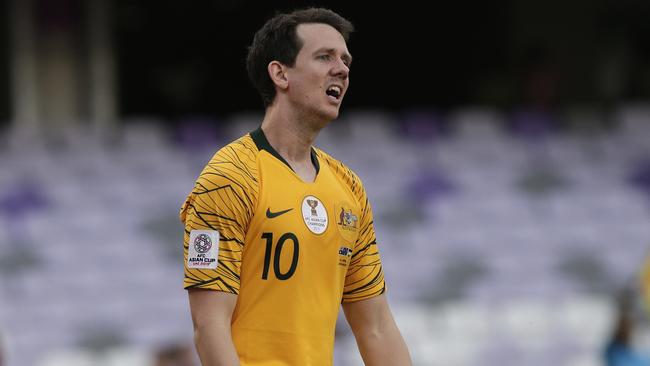 Australia's midfielder Robbie Kruse walks in dejection after Jordan's defender Anas Bani Yaseen during the AFC Asian Cup group B soccer match between Australia and Jordan at the Hazza Bin Zayed stadium in Al Ain, United Arab Emirates, Sunday, Jan. 6, 2019. (AP Photo/Nariman El-Mofty)