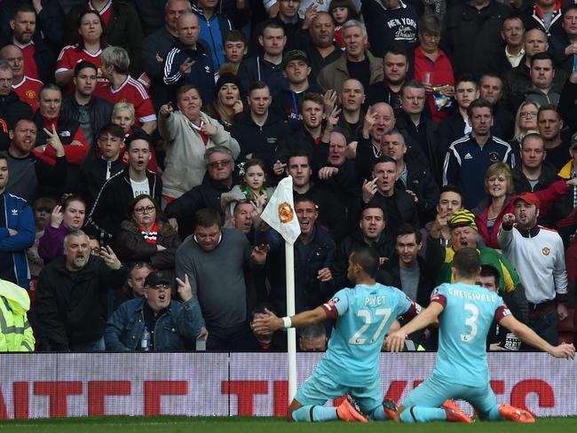 Manchester United fans salute Dimitri Payet’s second goal against them.