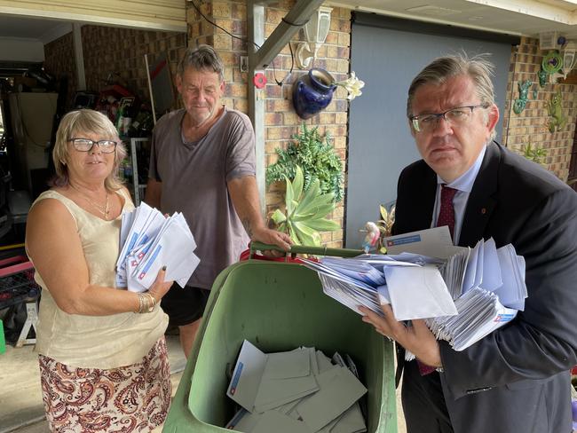 Annette Weller, Kevin Weller, Senator Paul Scarr with the dumped mailers. Picture Supplied