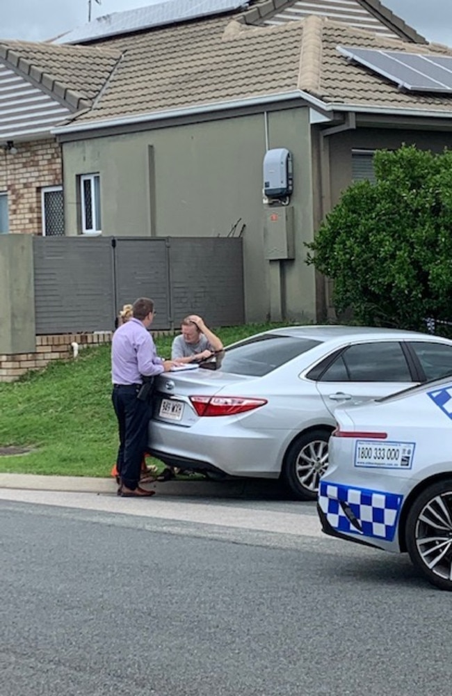 Police speak to neighbours at the crime scene. Picture: Greg Stolz