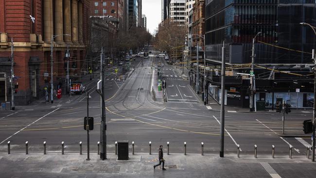 A man walks past Southern Cross Station in Melbourne on Monday. Picture: Daniel Pockett