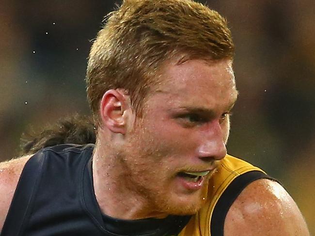 MELBOURNE, AUSTRALIA - APRIL 24: Nick Vlastuin of the Tigers is tackled by Angus Brayshaw of the Demons during the round four AFL match between the Richmond Tigers and the Melbourne Demons at Melbourne Cricket Ground on April 24, 2015 in Melbourne, Australia. (Photo by Quinn Rooney/Getty Images)