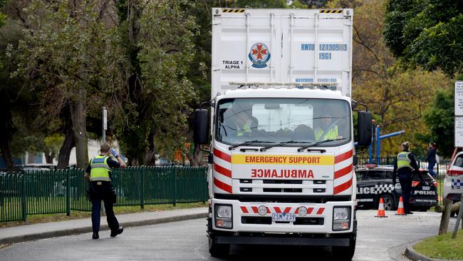 Ambulance support crews at the Flemington public housing estate. Picture: Andrew Henshaw