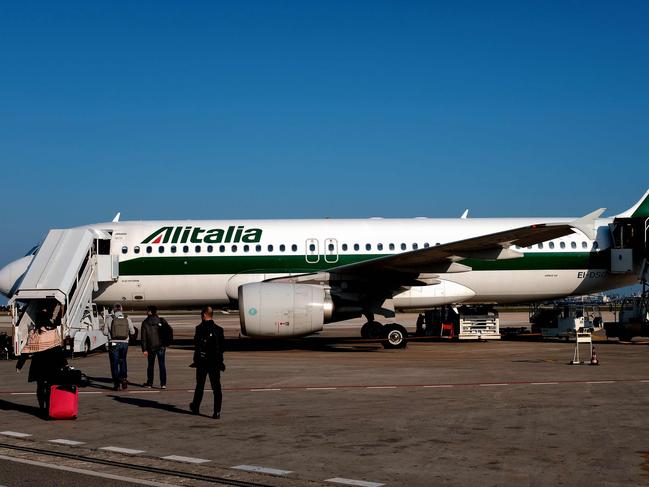 Passengers arrived from New York on an Alitalia flight. Picture: AFP.