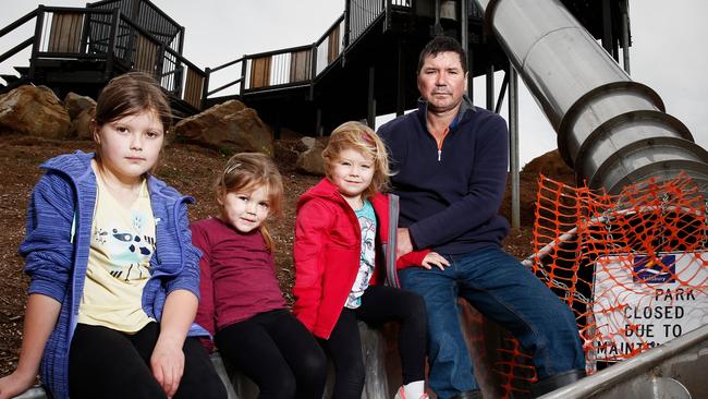 Greg Szymaniak with his kids Kasia, 8, Elsa, 4 and Sienna, 6, are disappointed the slides have been closed. Pic: Matt Loxton