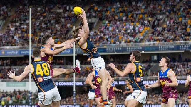 Young Crow Josh Worrell takes a big mark in front of Lion Josh Dunkley. Picture: Russell Freeman/AFL Photos