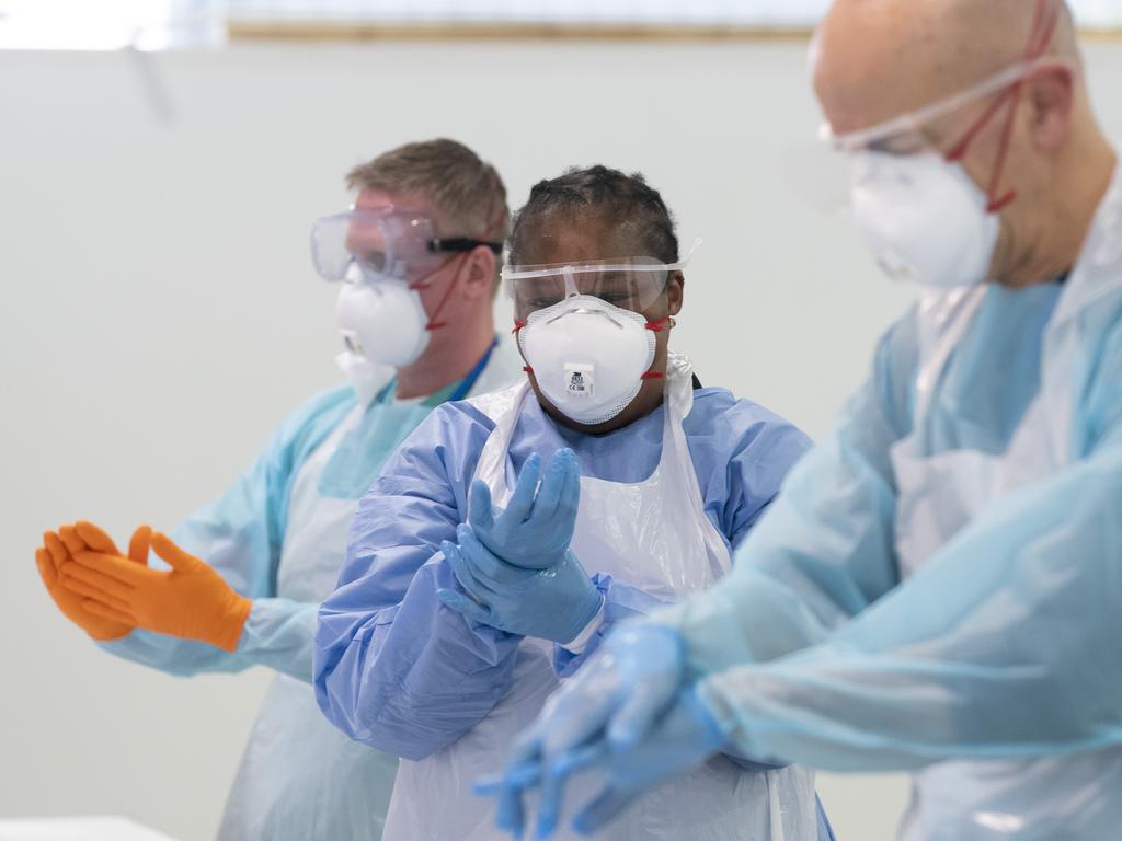 UK medical staff put on PPE. Picture: AP