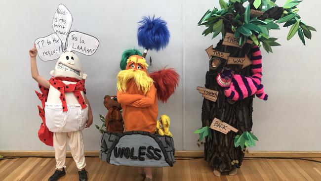 These three amazing costumes are all from the same family who attend Rochedale State School. Olivia Gava as the Cheshire Cat in a tree. Matilda Gava as the Lorax sitting on the “Unless” and Lachlan Gava as Captain Underpants. Picture: Sheree Gava