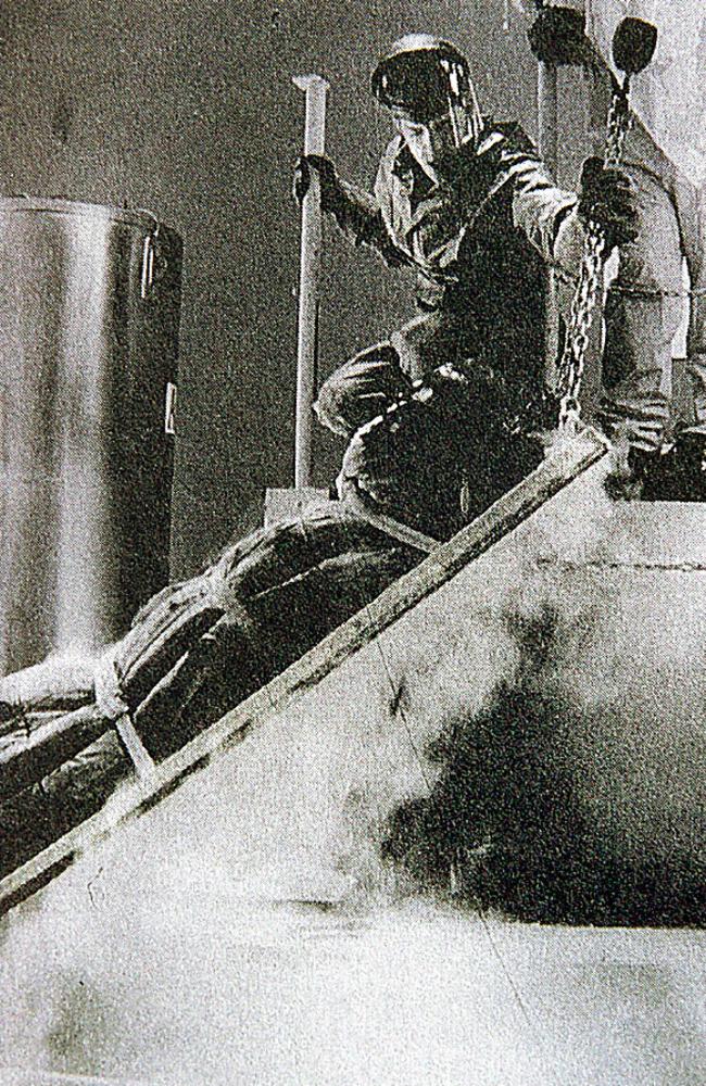 Technicians prepare a body for freezing in a cryogenic chamber. Picture: News Corp.