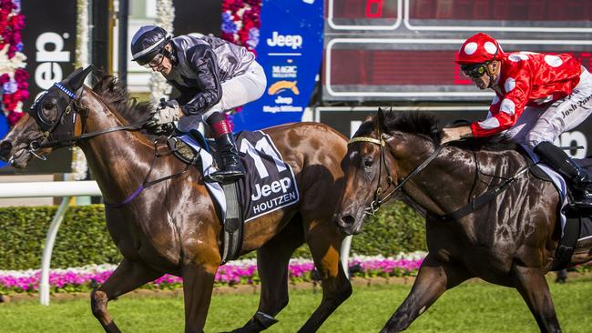 Jockey Jeff Lloyd riding Houtzen wins the Magic Millions 2YO Classic at the Magic Millions racing carnival at the Gold Coast Turf Club on the Gold Coast, Saturday, Jan. 14, 2017. Picture: AAP, Glenn Hunt.